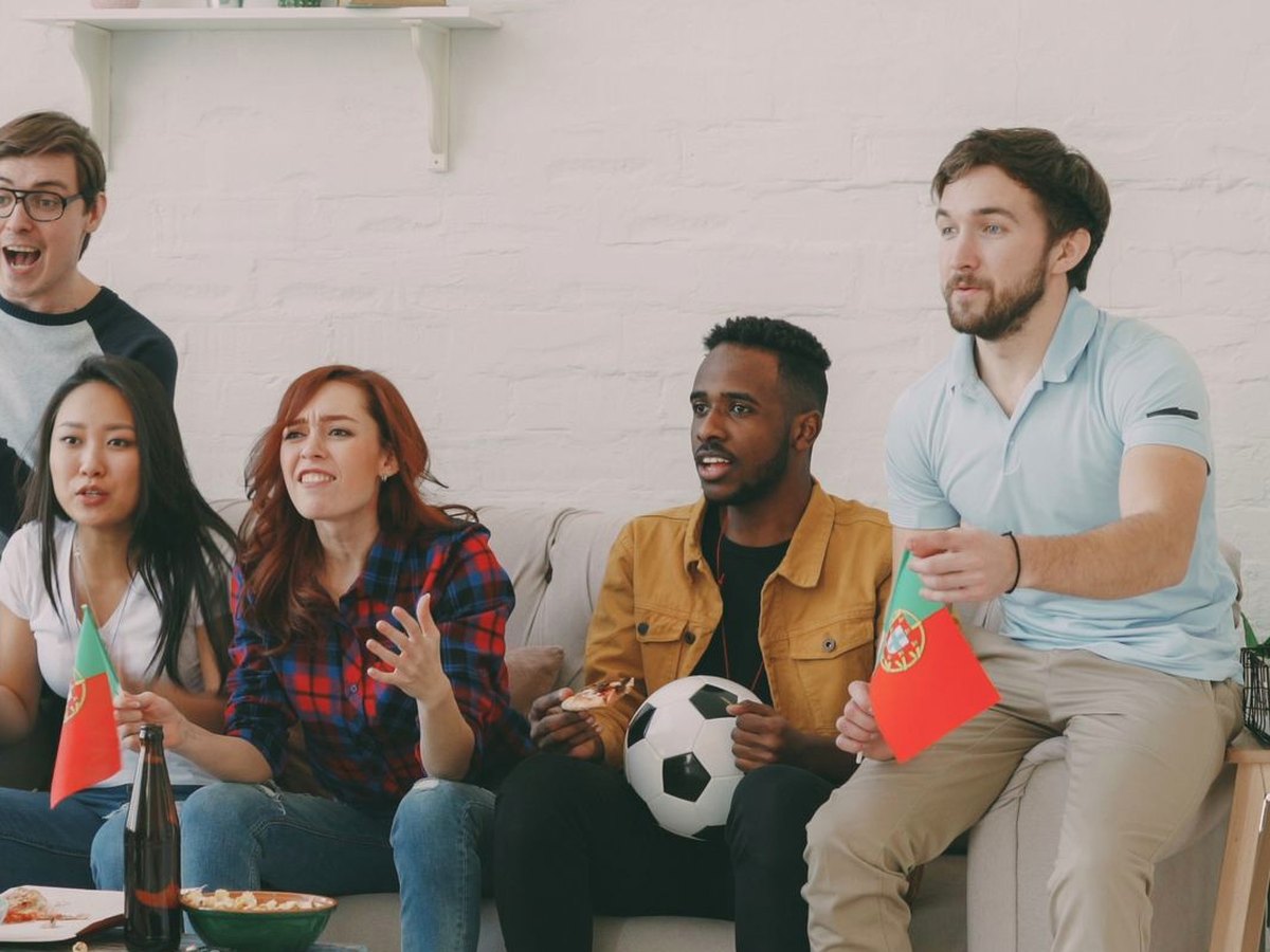 Friends watching the game together at home
